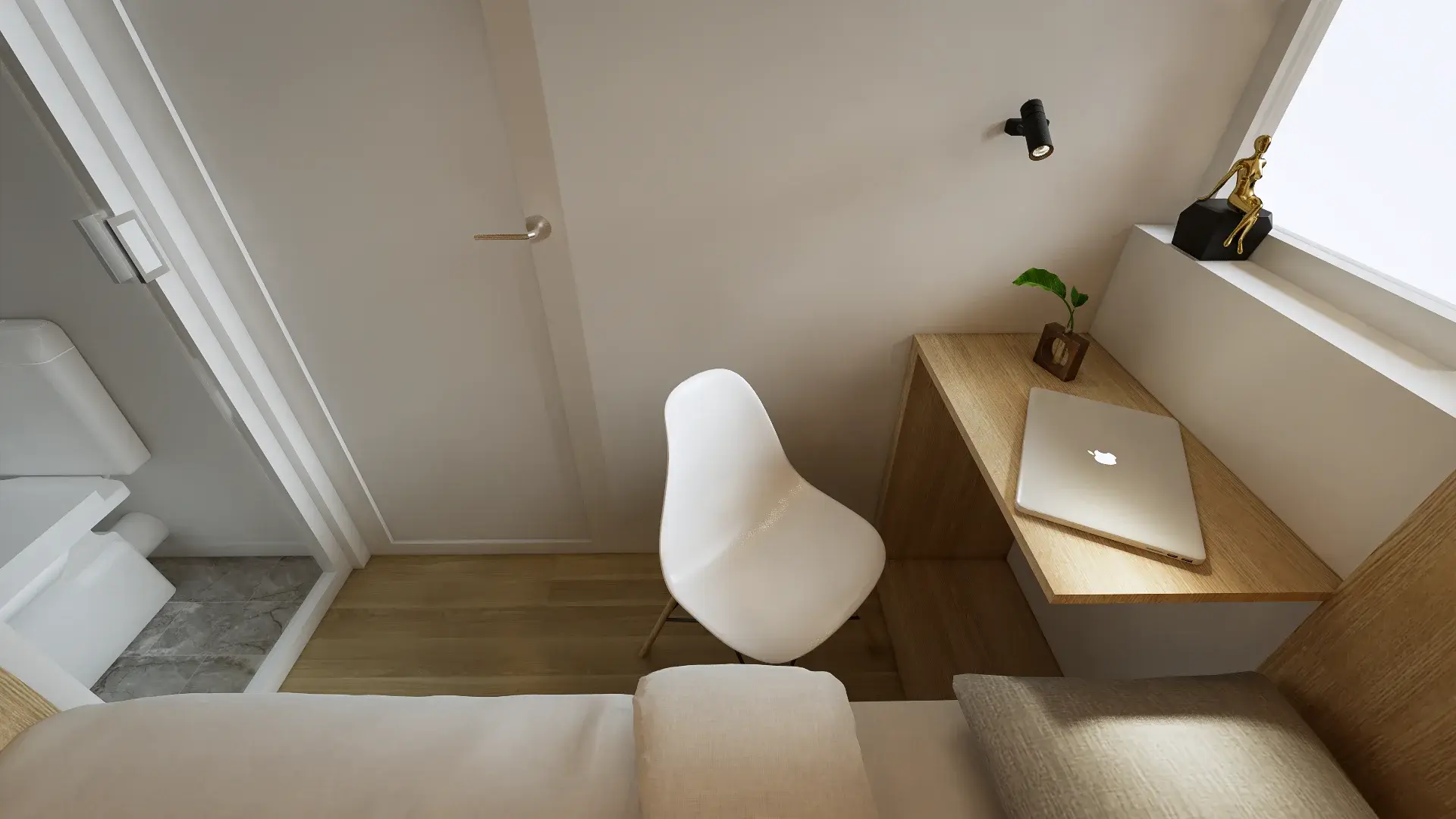 Overhead view of the window-side workspace beside the bed and ensuite entrance